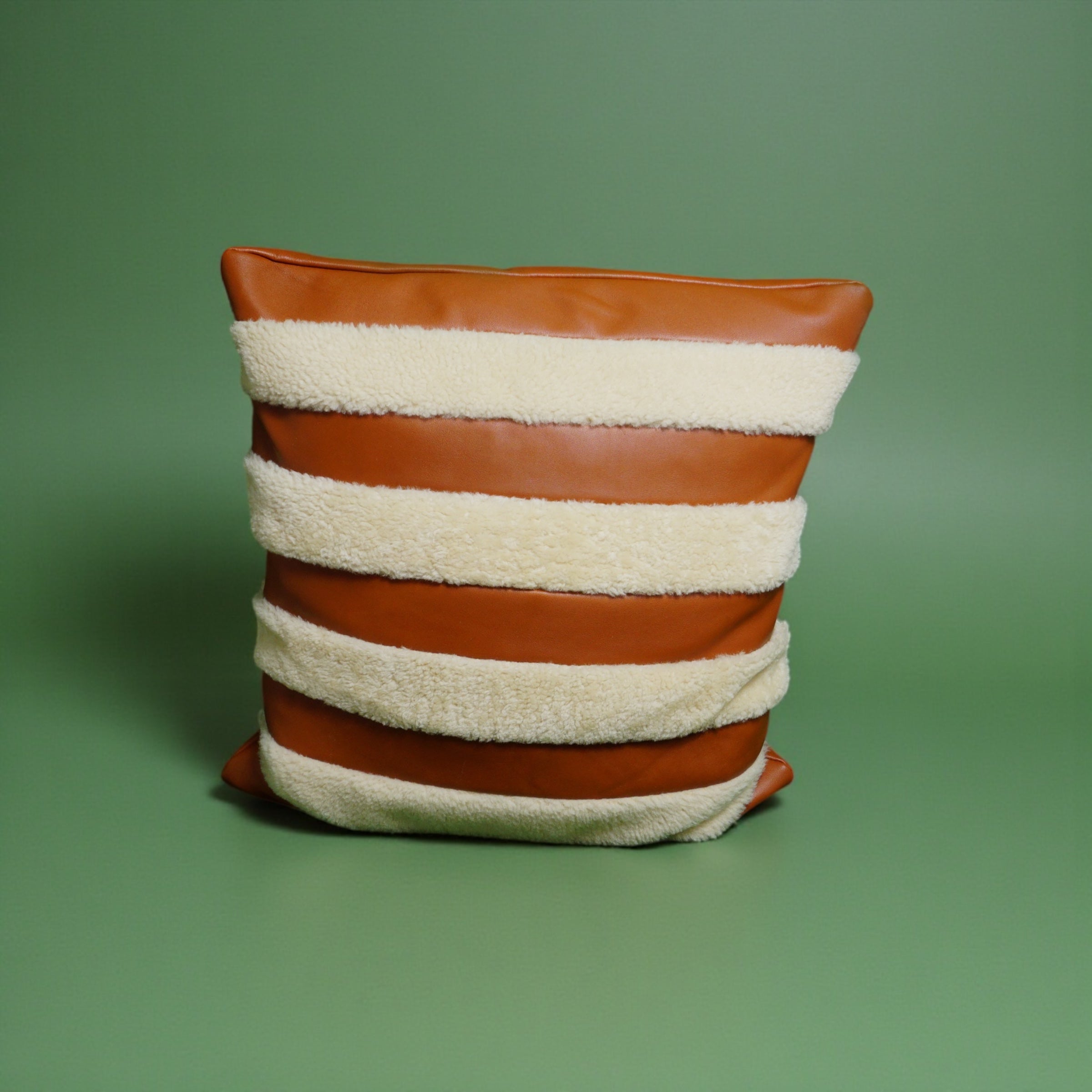 The Marinero tan leather and shearling pillow cover