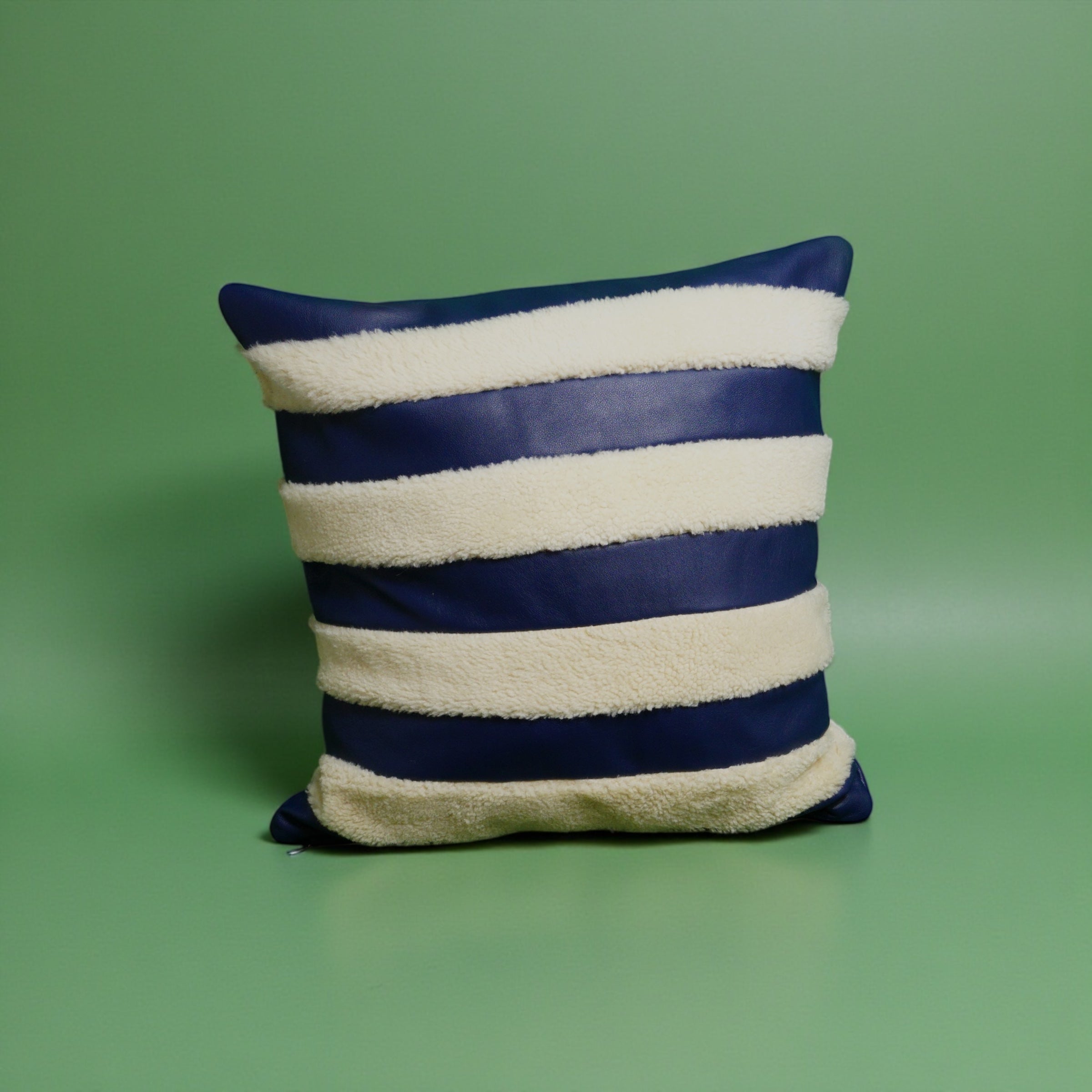 The Marinero navy leather and shearling pillow cover
