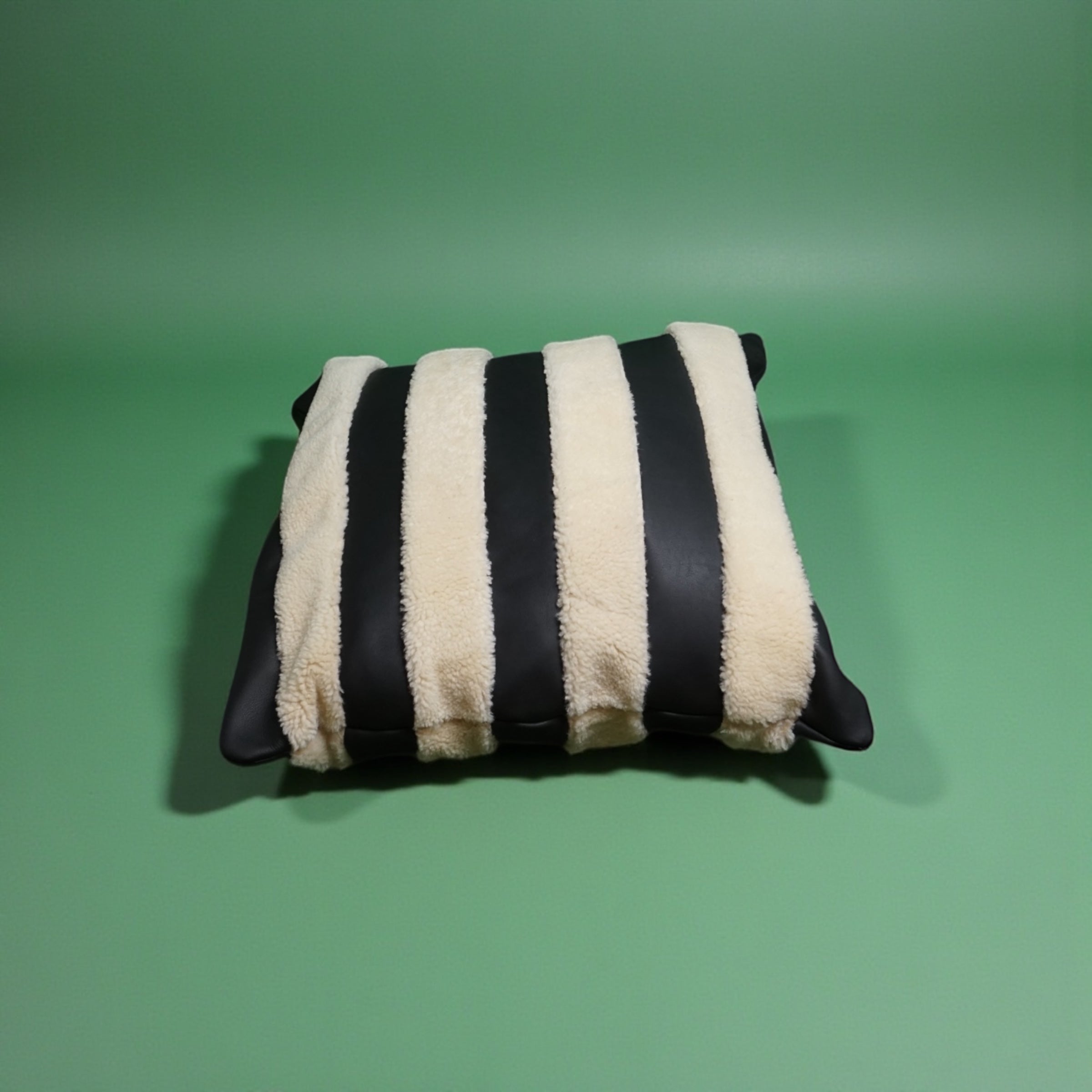 The Marinero black leather and shearling pillow cover