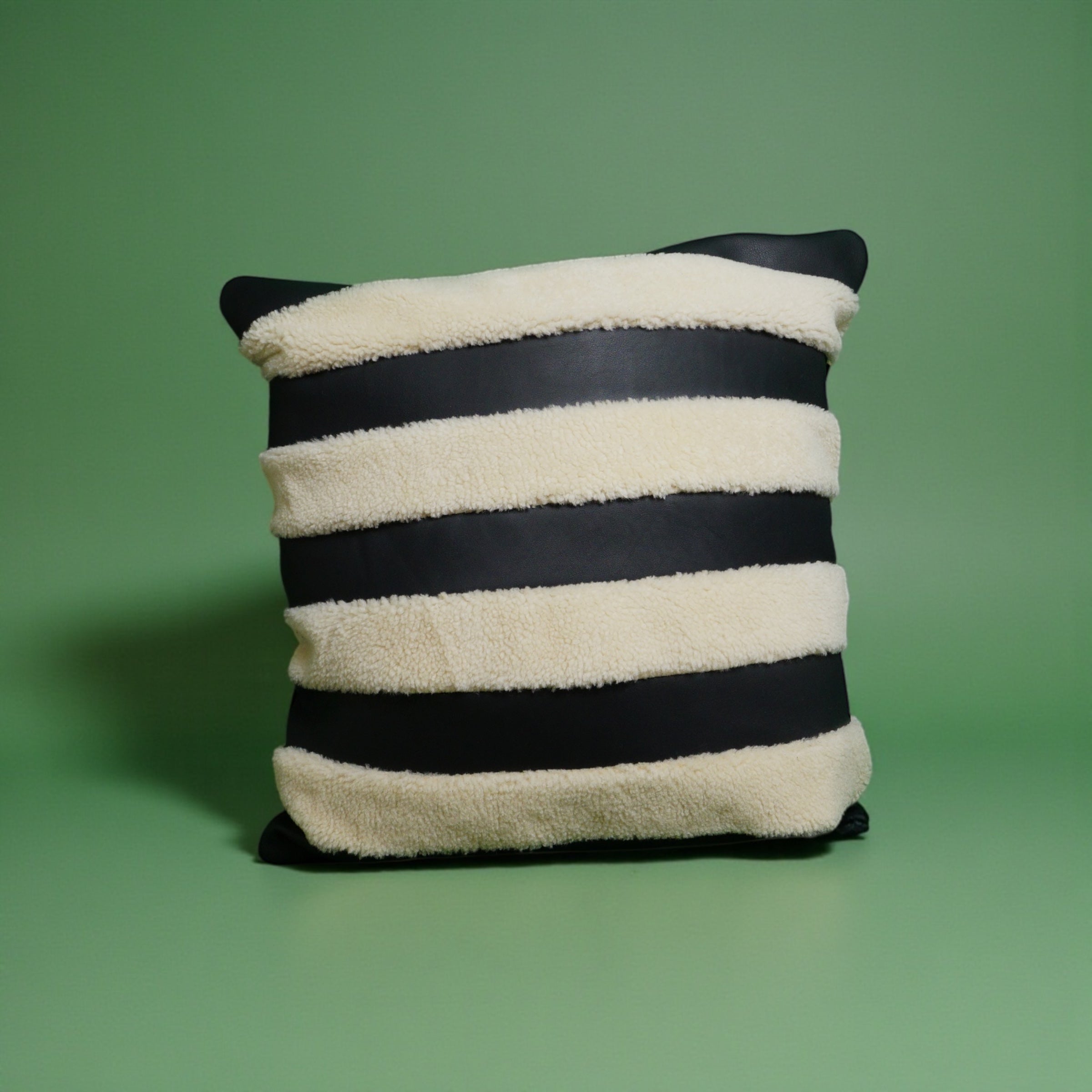 The Marinero black leather and shearling pillow cover